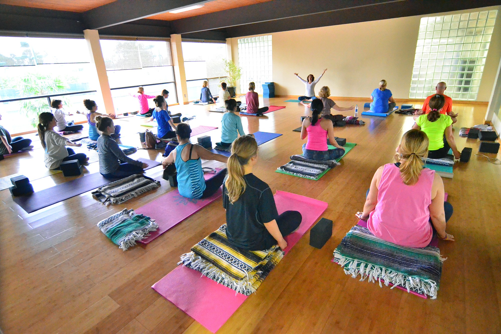 Yoga 1 studio filled with yoga students in class at Red's in Lafayette, LA.